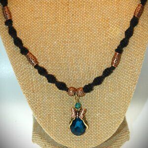 Teardrop Blue Topaz Colored Butterfly on a 22 1/4" Handmade Black Hemp Chain